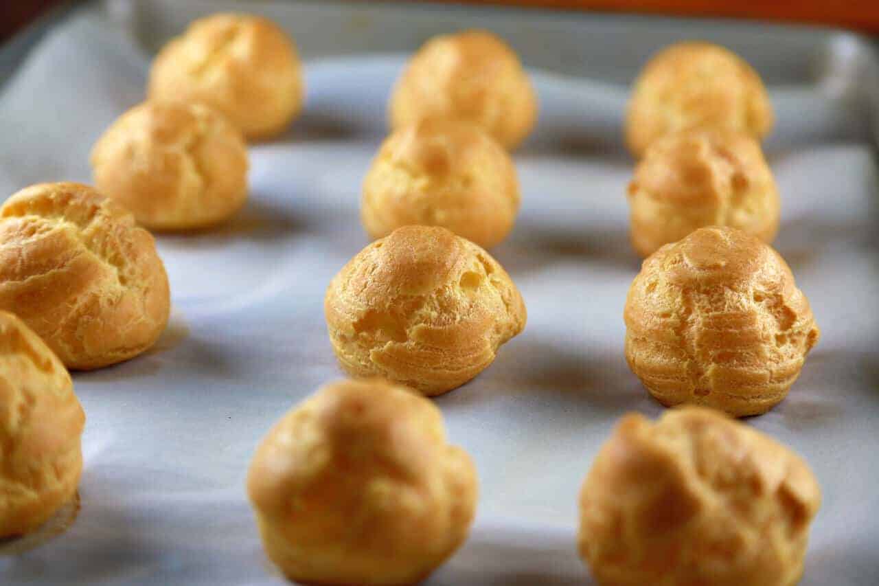 profiteroles on a baking sheet