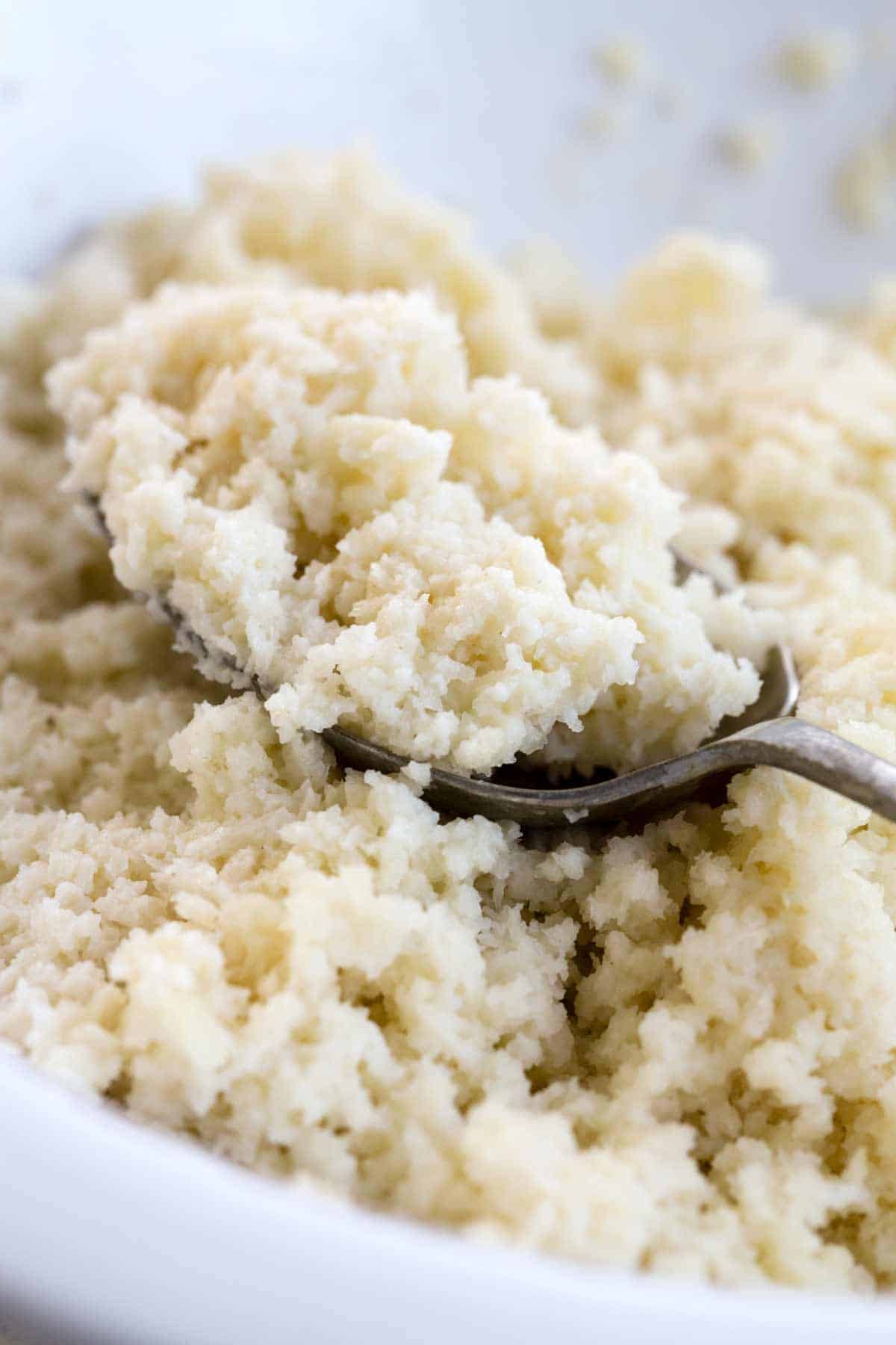 Spoon holding panade mixture to use with ground meat.