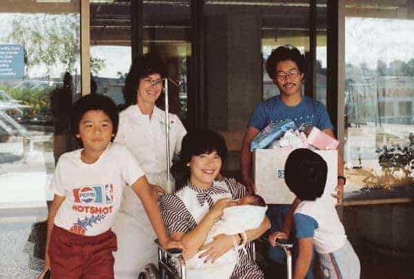 Jessica being carried by her mom out of the hospital