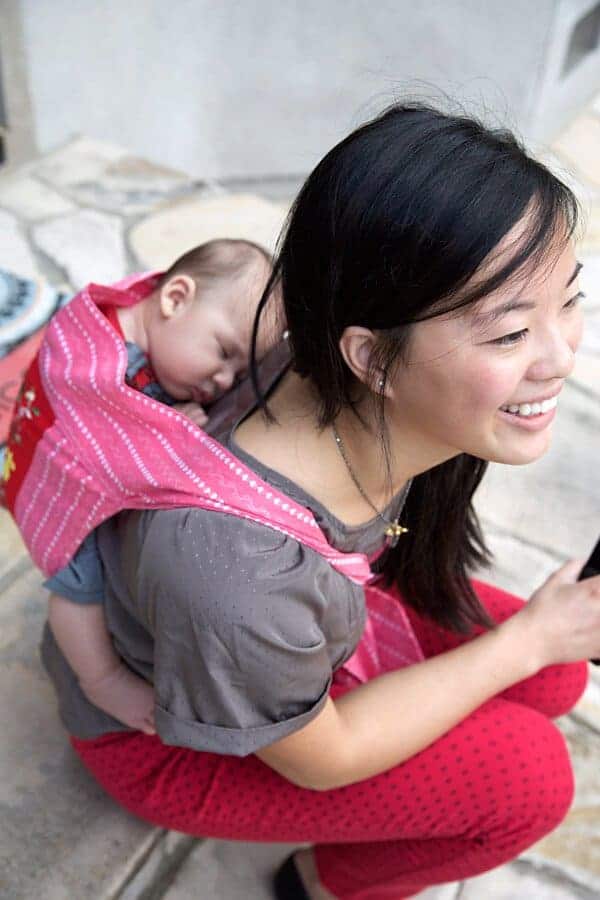 Taryn carrying a very tired James around