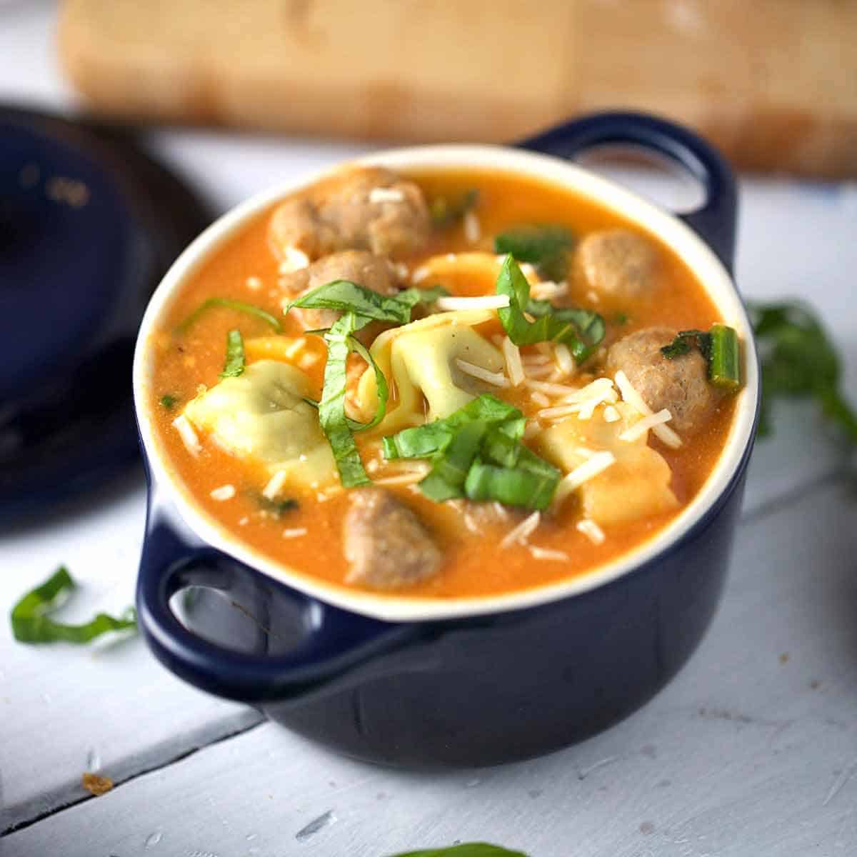 Tuscan Tomato Tortellini Soup with Italian Sausage and Greens