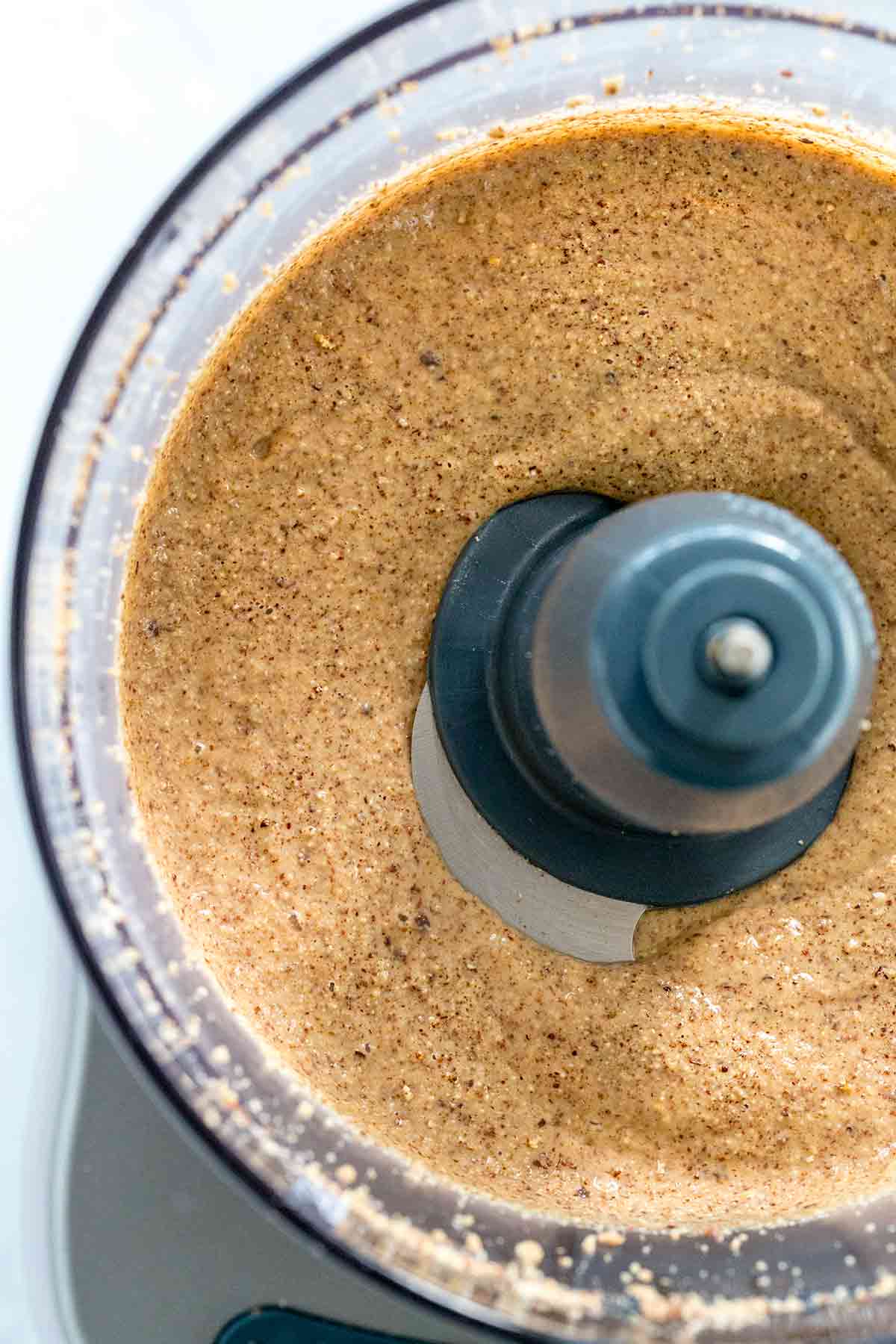Homemade almond butter in a food processor.
