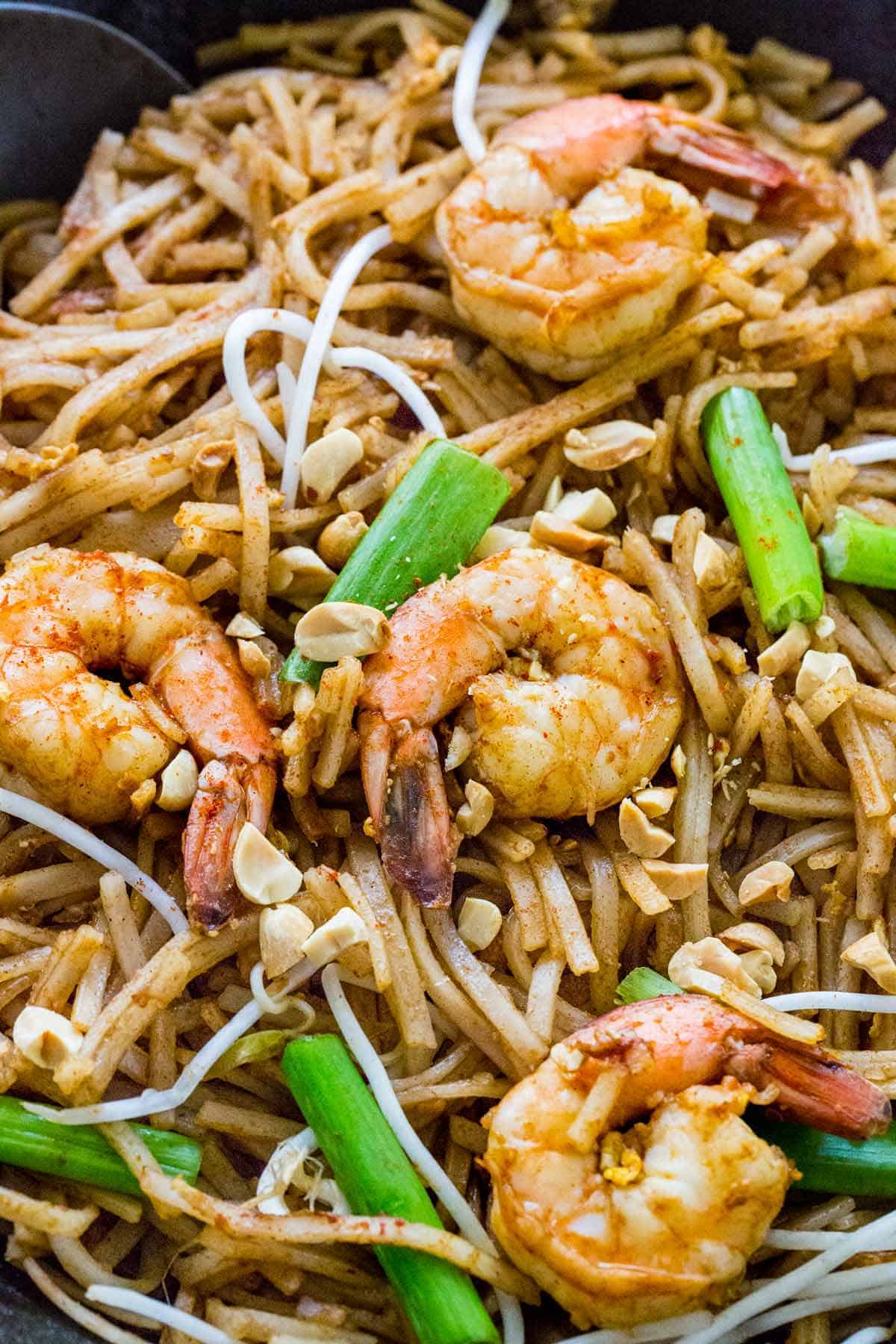 Pad Thai noodles stir-fried and tossed in a flavorful sauce. This authentic recipe features succulent shrimp, but you can also use chicken, beef, tofu or a combination. #padthai #thairecipes