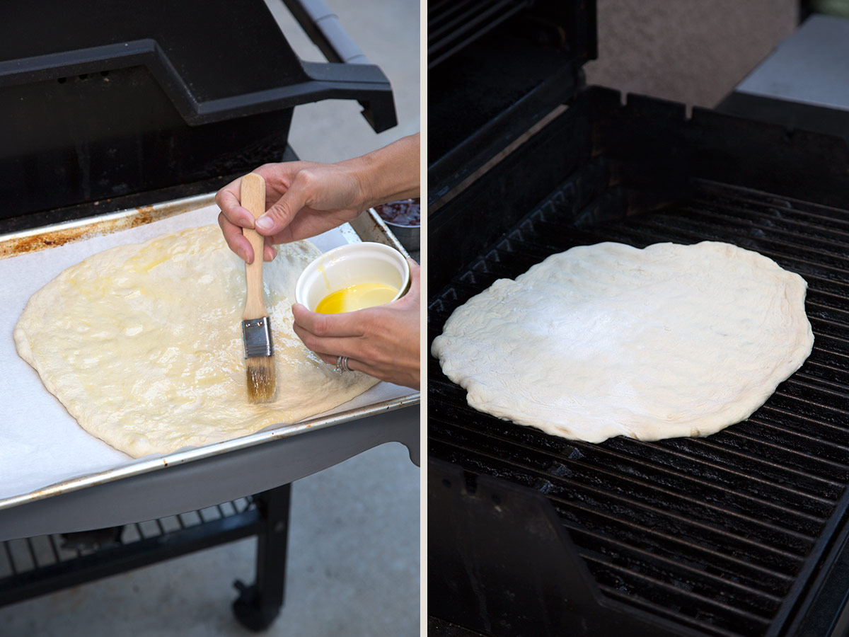Brushing olive oil onto stretched pizza dough, then placing the dough directly onto outdoor grill grates.