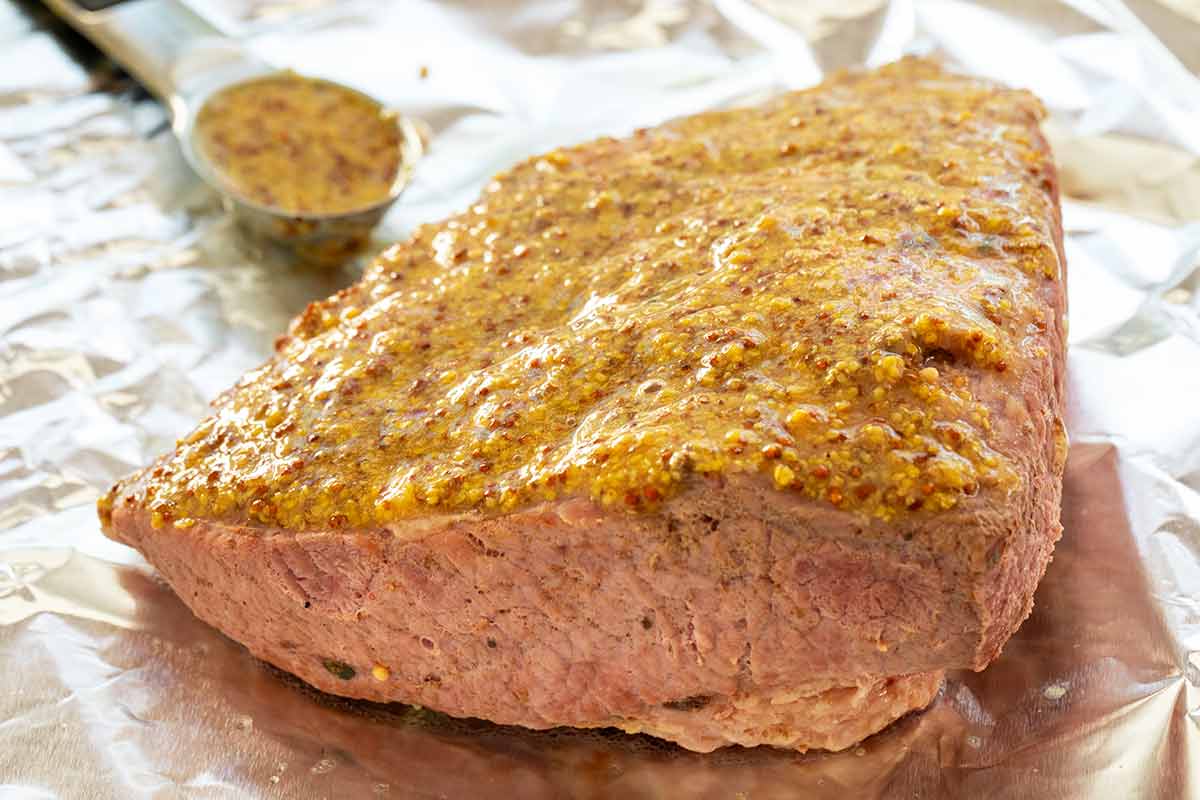 Corned beef brisket with mustard glazed on top.