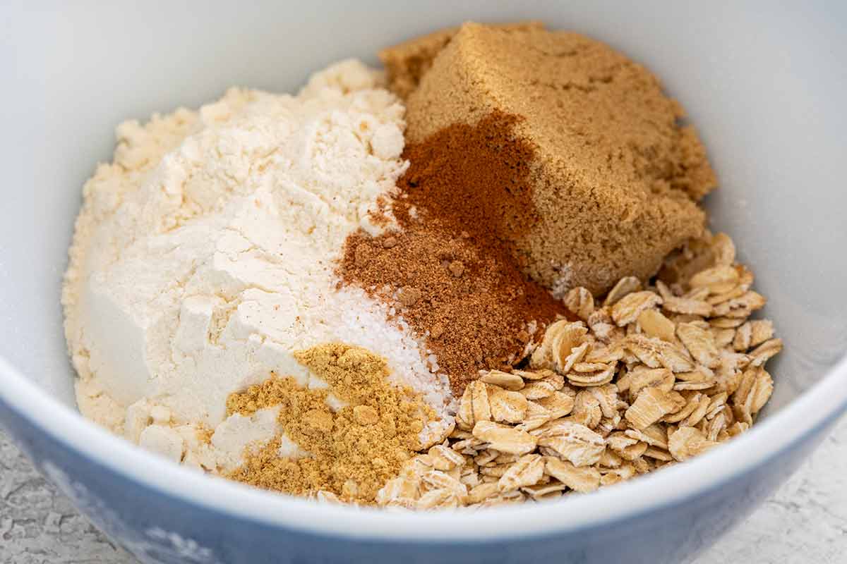 Bowl of flour, brown sugar, spices, and oats.