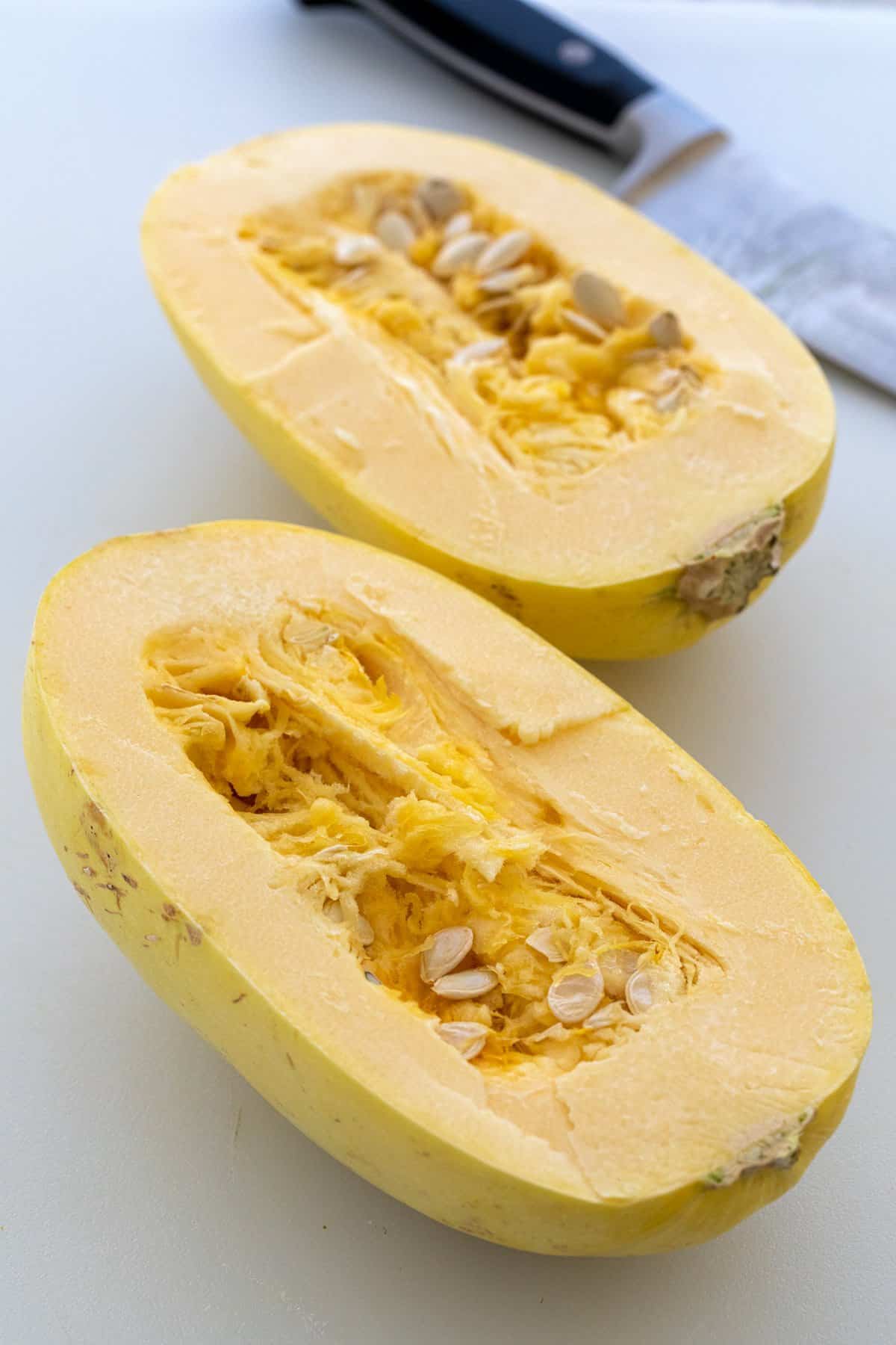 Spaghetti squash cut into two halves.