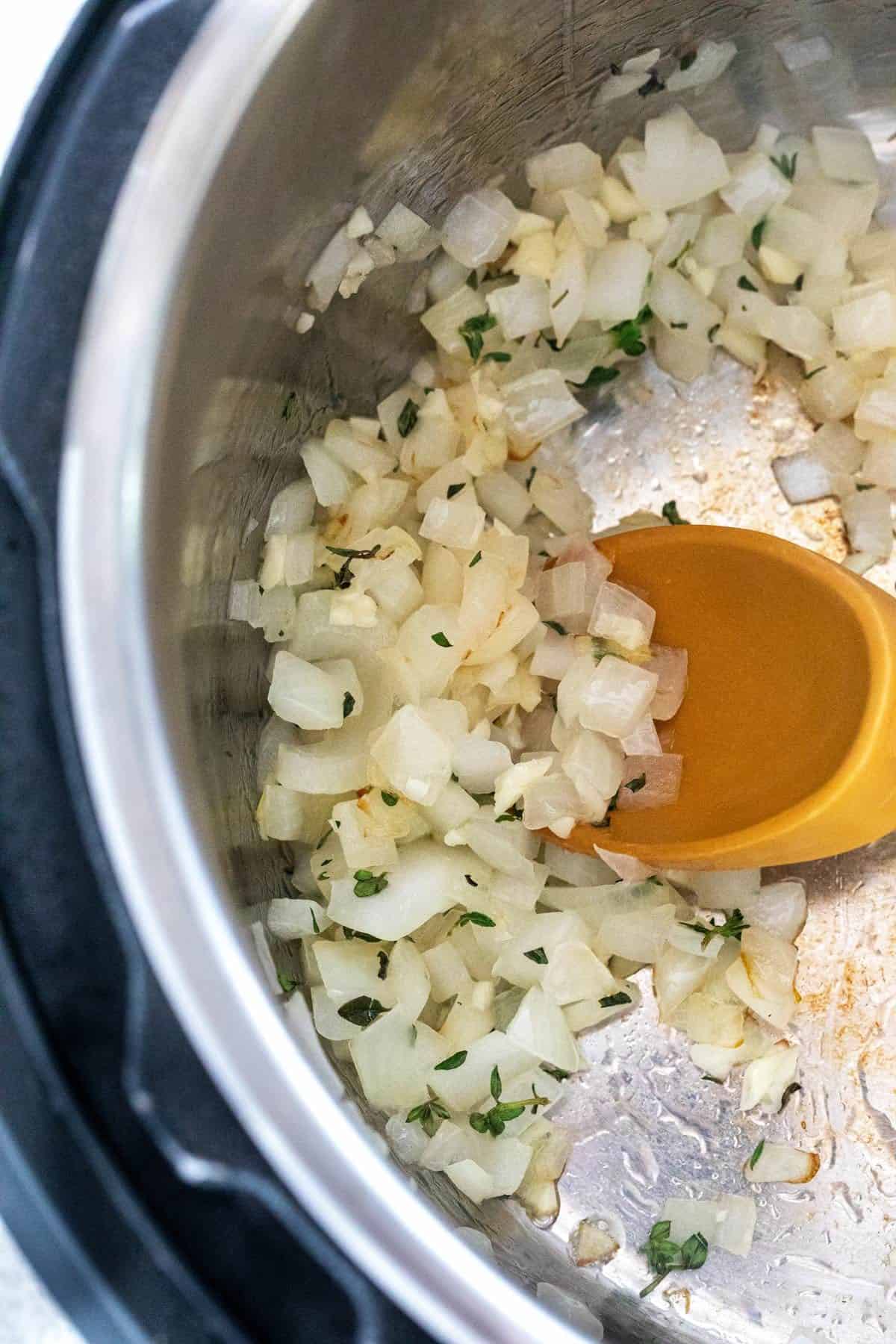 Diced onions sauteing inside the Instant Pot.