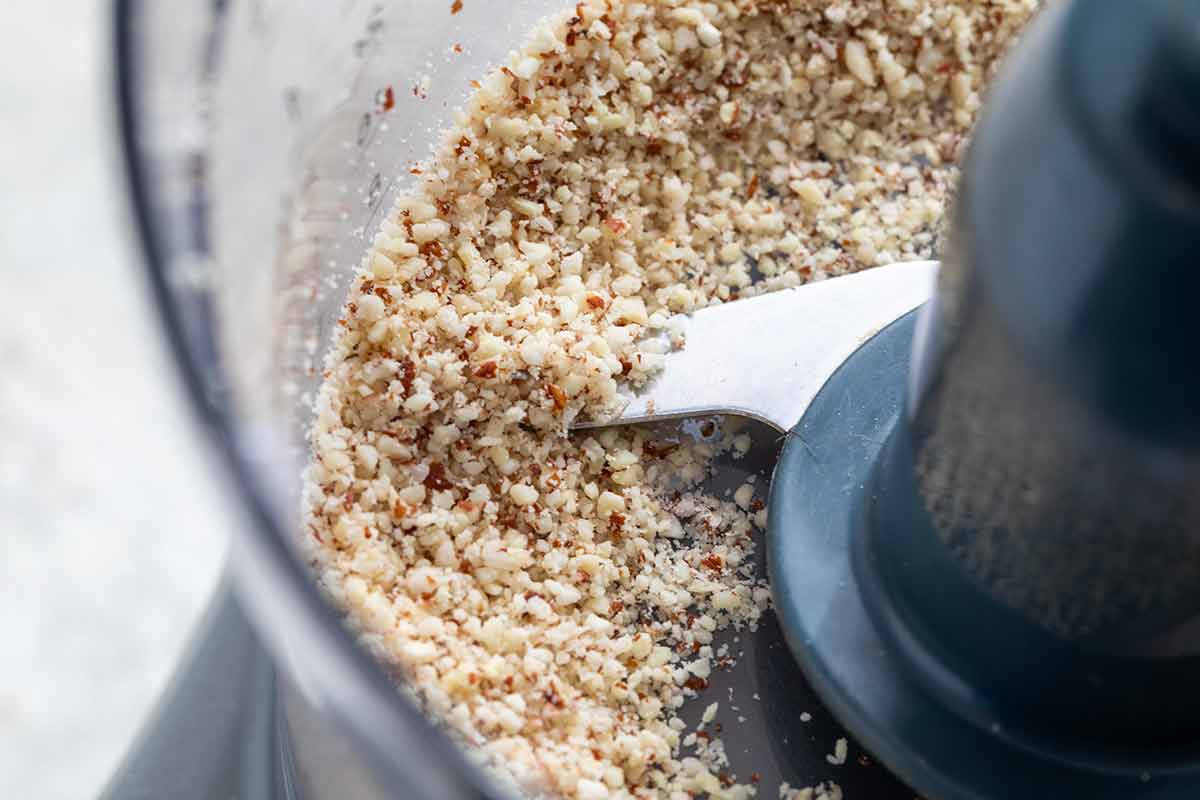 Grinding almonds in a food processor.