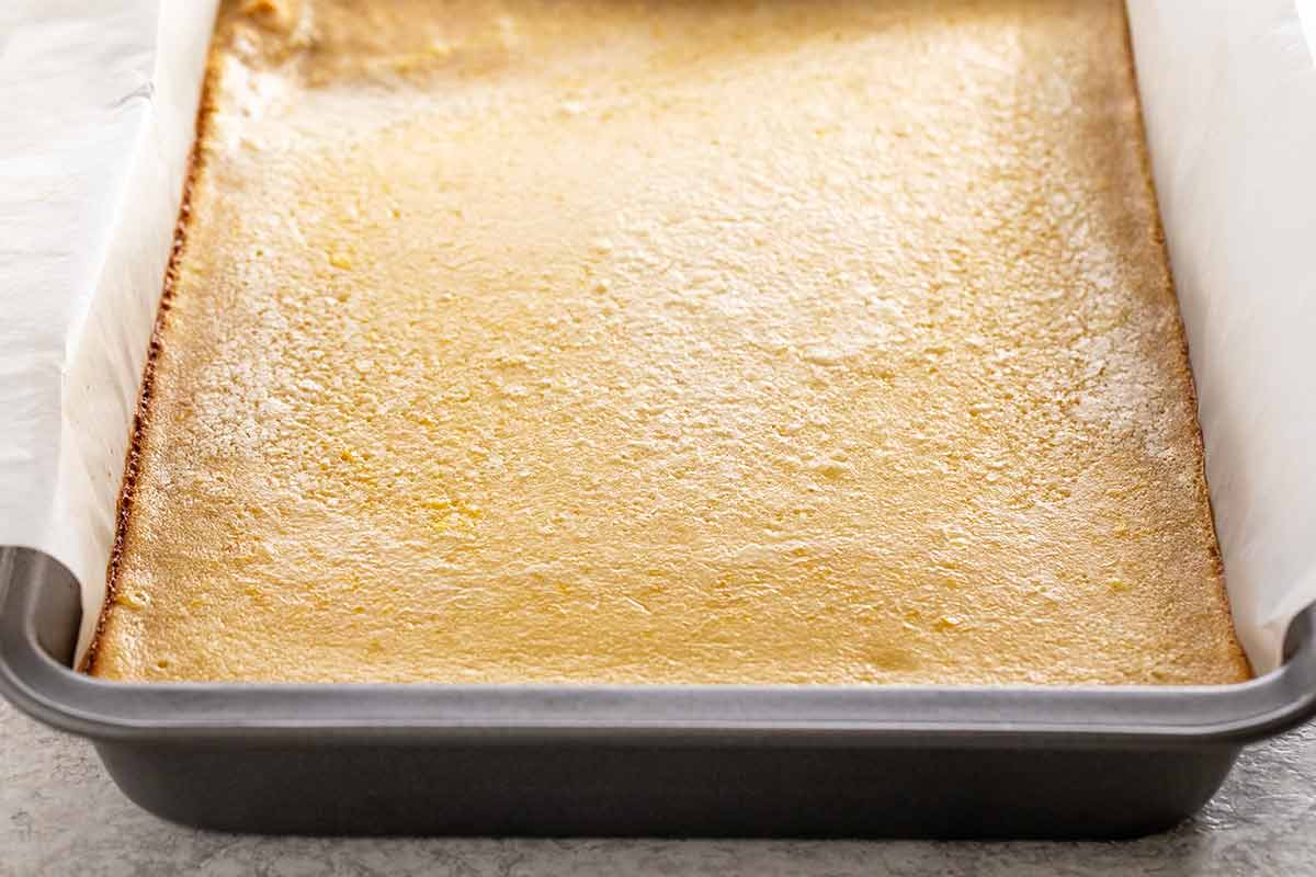 Bake lemon bar in a sheet pan with parchment paper on the edges.