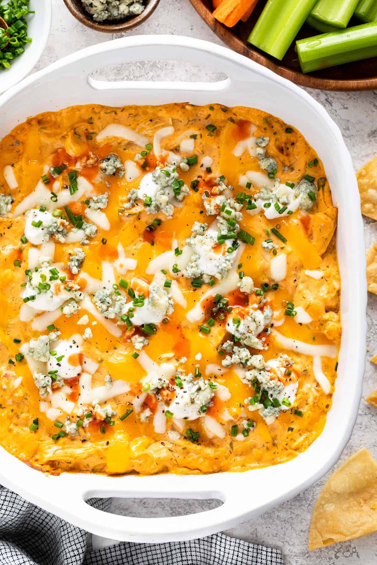 Baking dish with baked buffalo chicken dip.