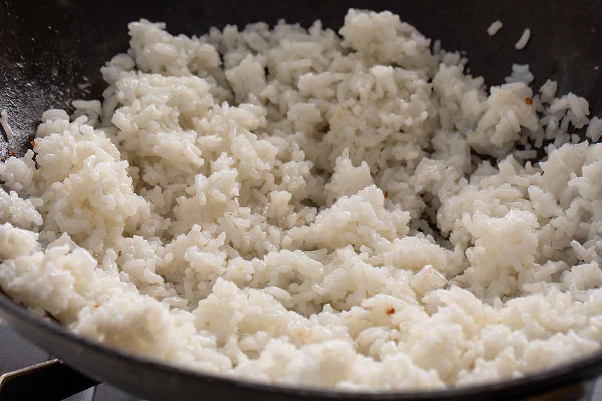 White rice stir frying in a wok.