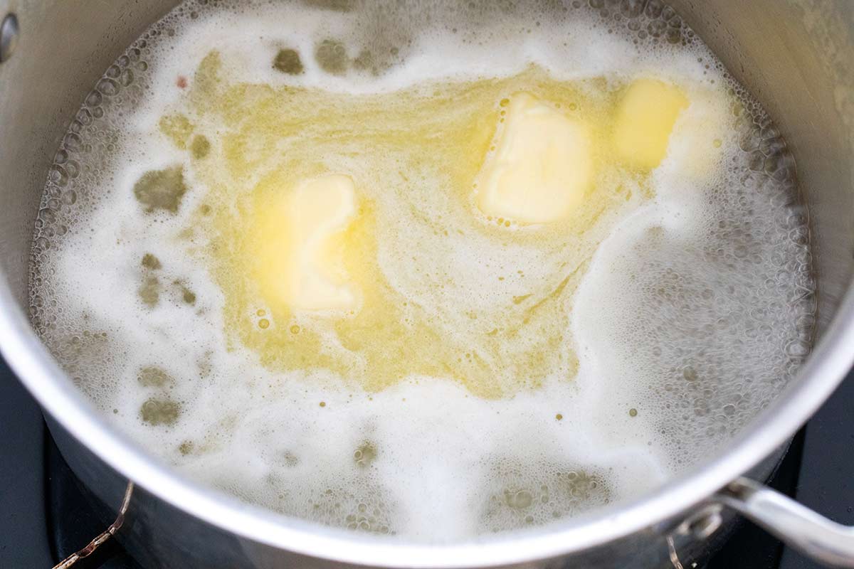 Butter, sugar, and salt boiling in a pot.