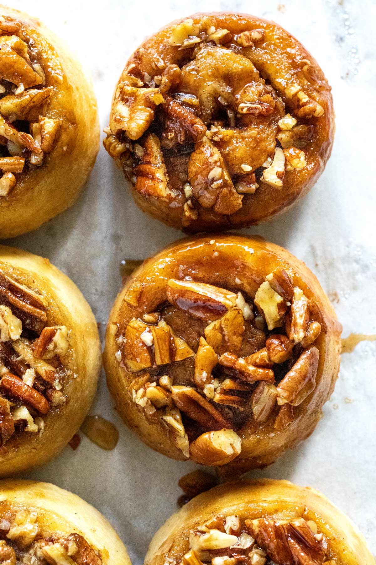 Non yeast sticky buns on parchment paper.