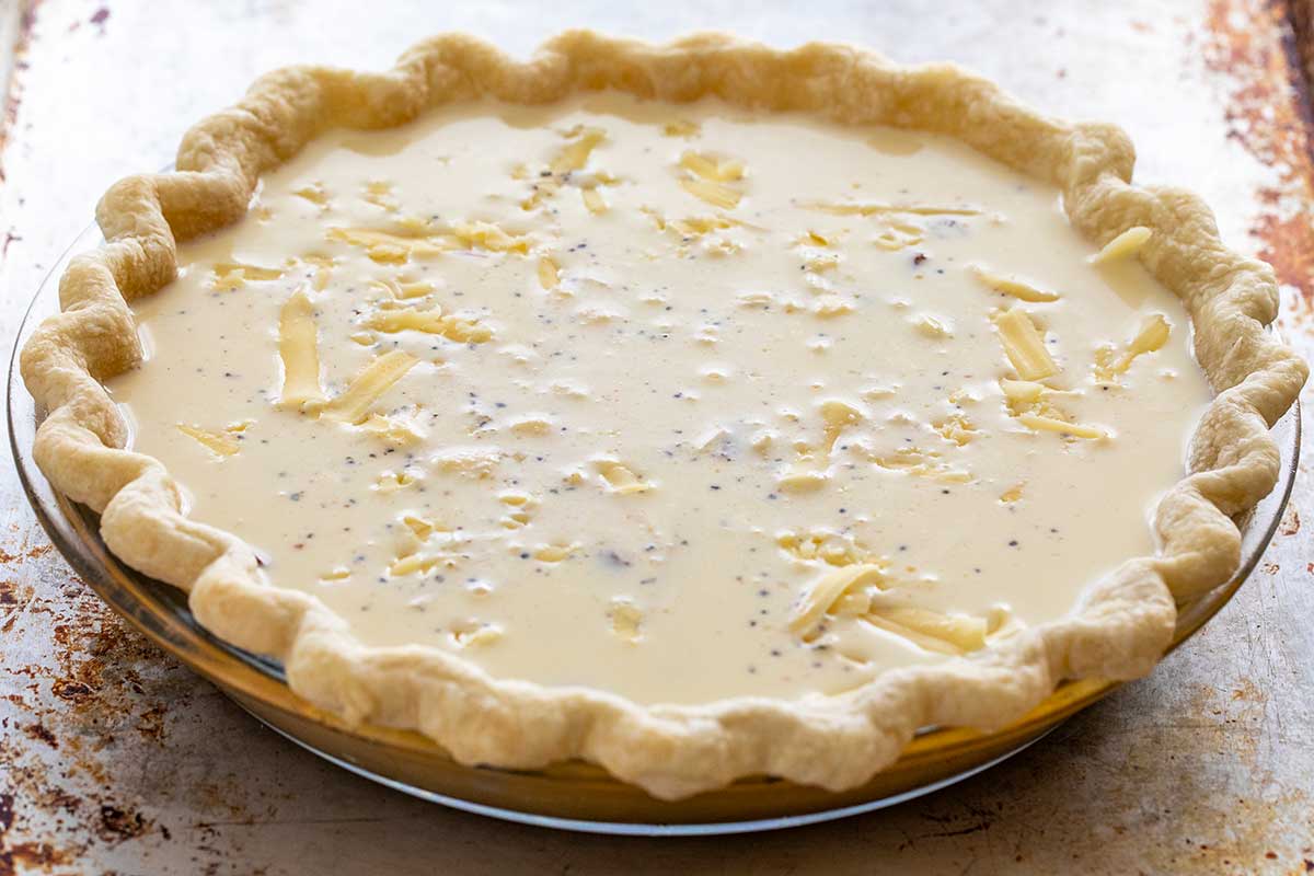Custard filling inside a pie crust.