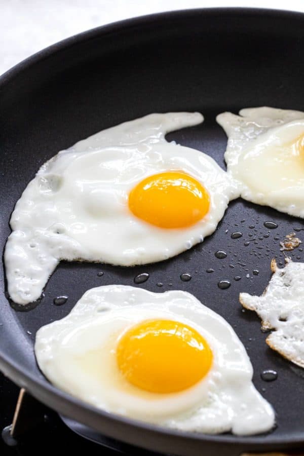 frying eggs in a pan