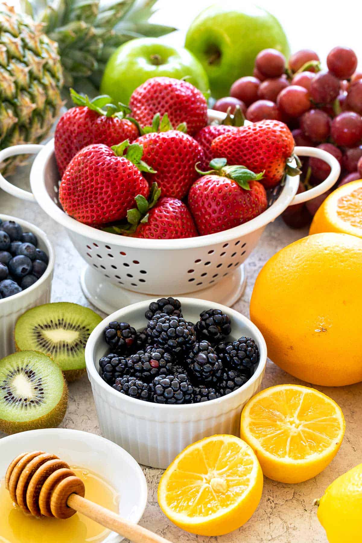 A bunch of fruit ingredients to make a classic fruit salad.