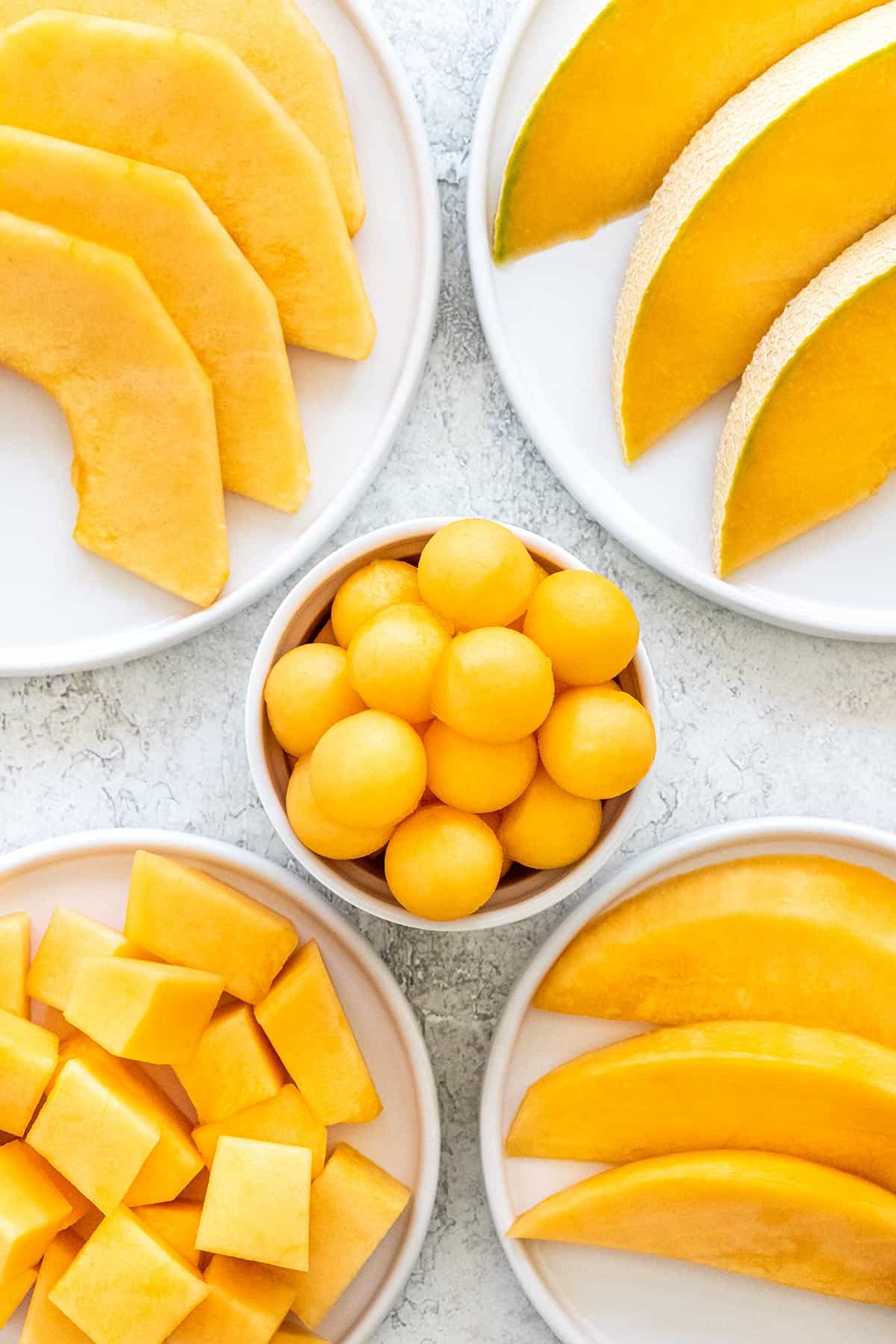 Cantaloupe cut into a various shapes and sizes.