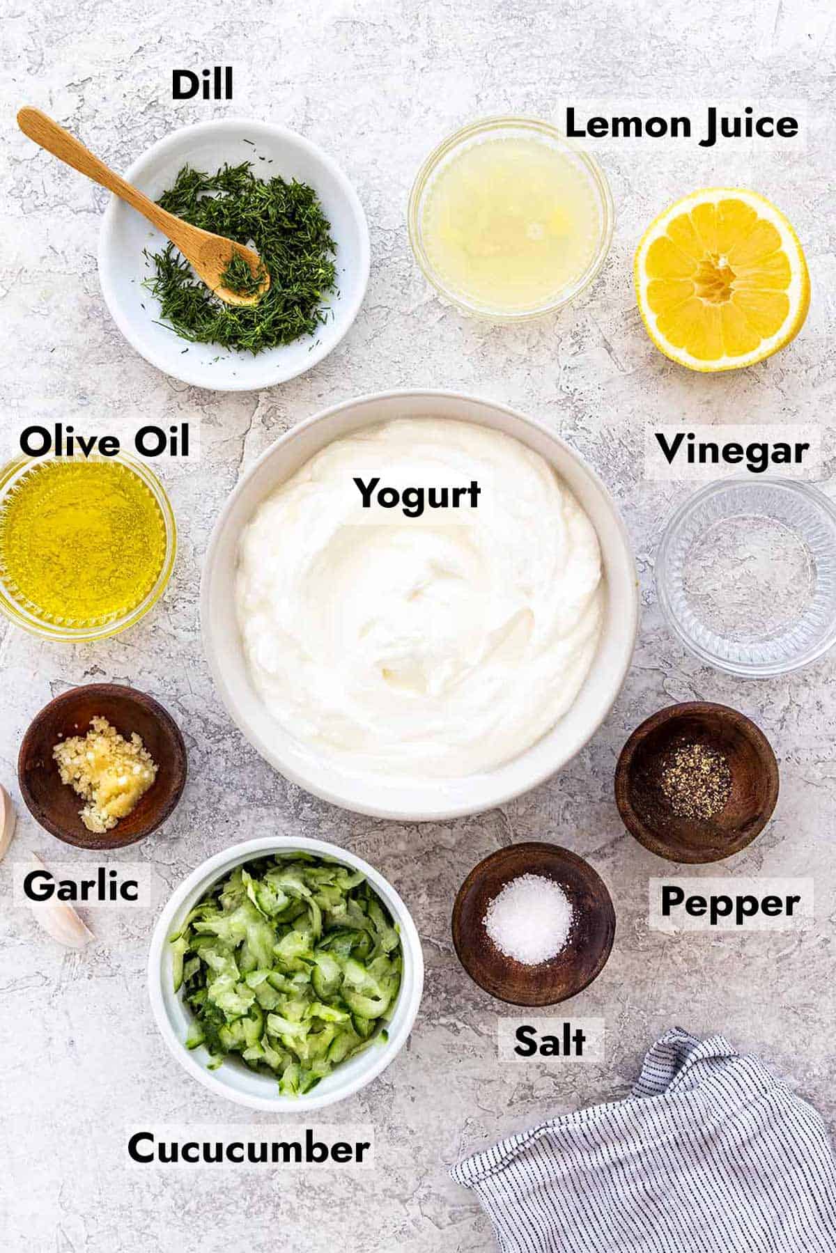 Several bowl of ingredients needed to make this tzatziki sauce recipe.