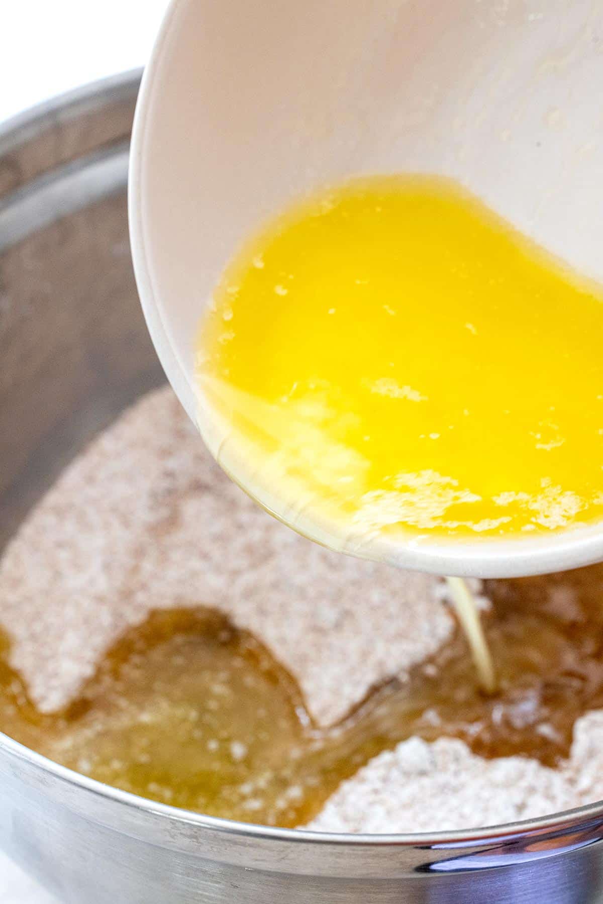 Melted butter being poured into a bowl.