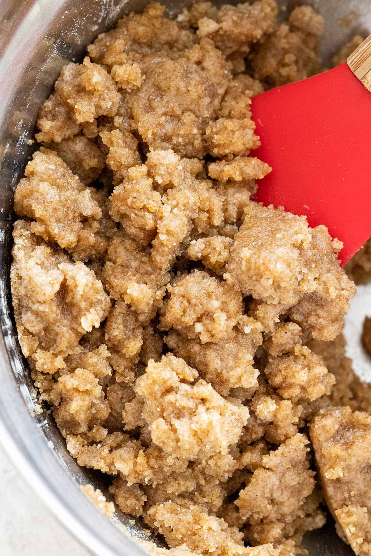 Stirring a bowl of crumble topping.