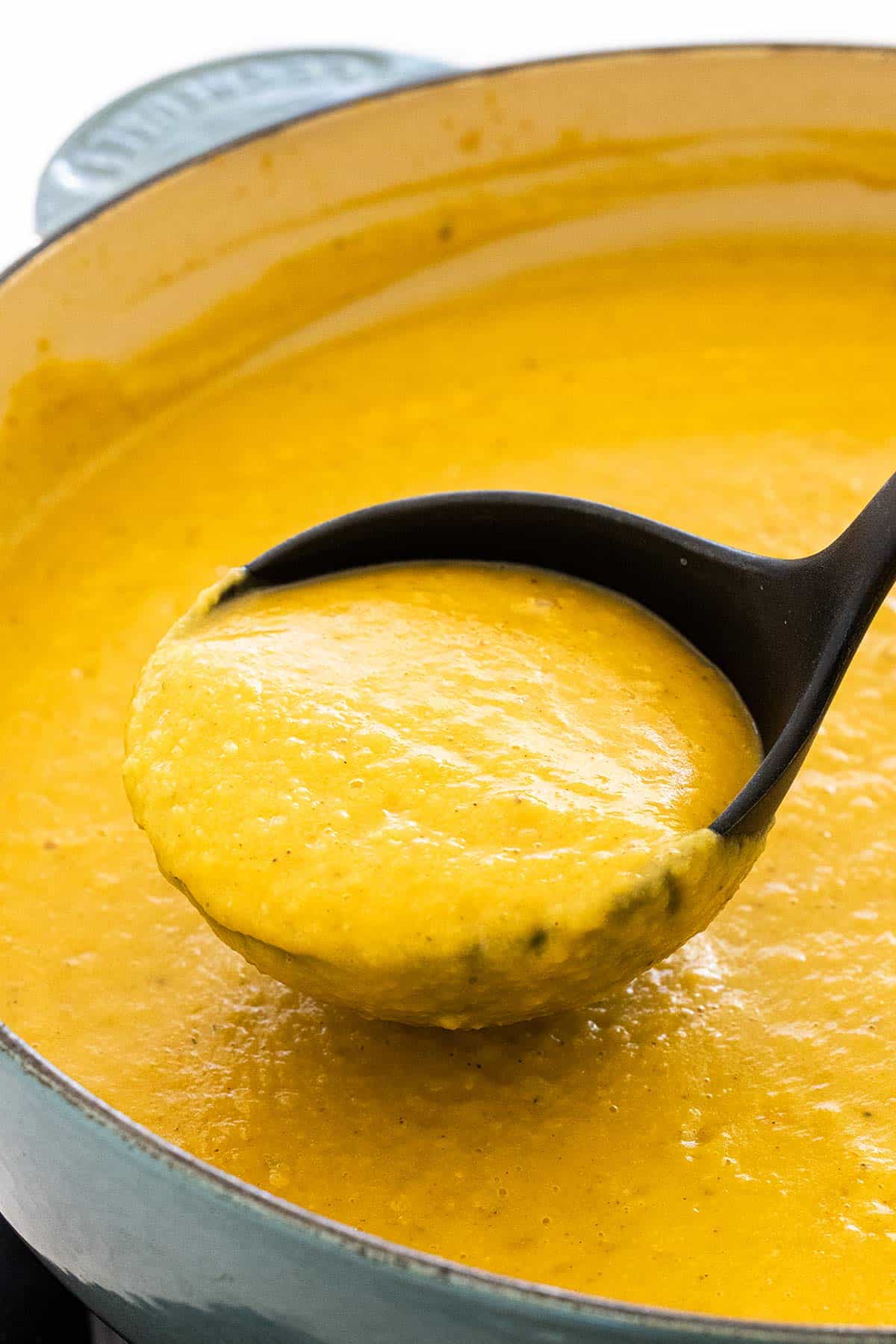 Ladle of pumpkin soup.