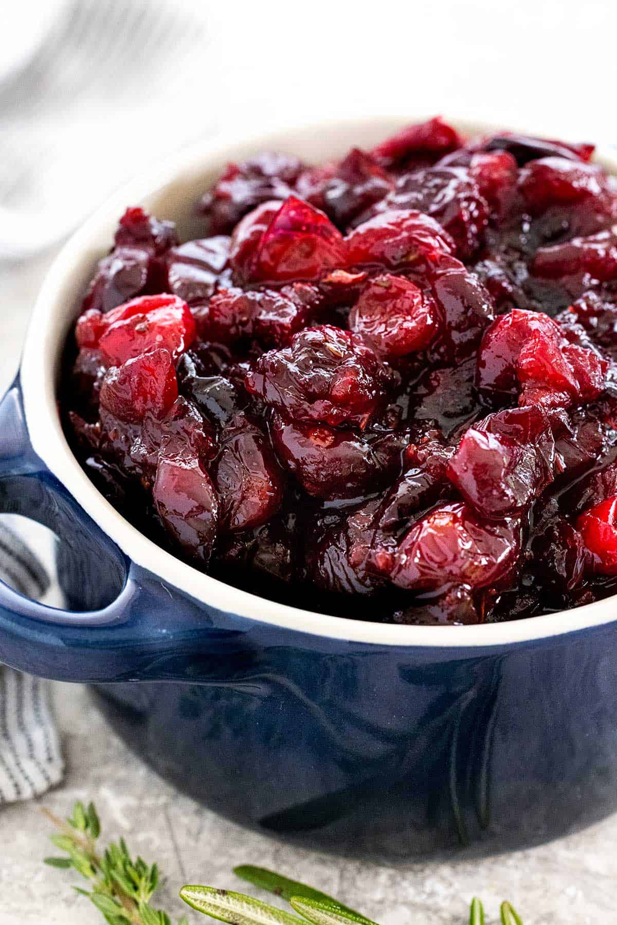 Herb cranberry sauce in a blue bowl.
