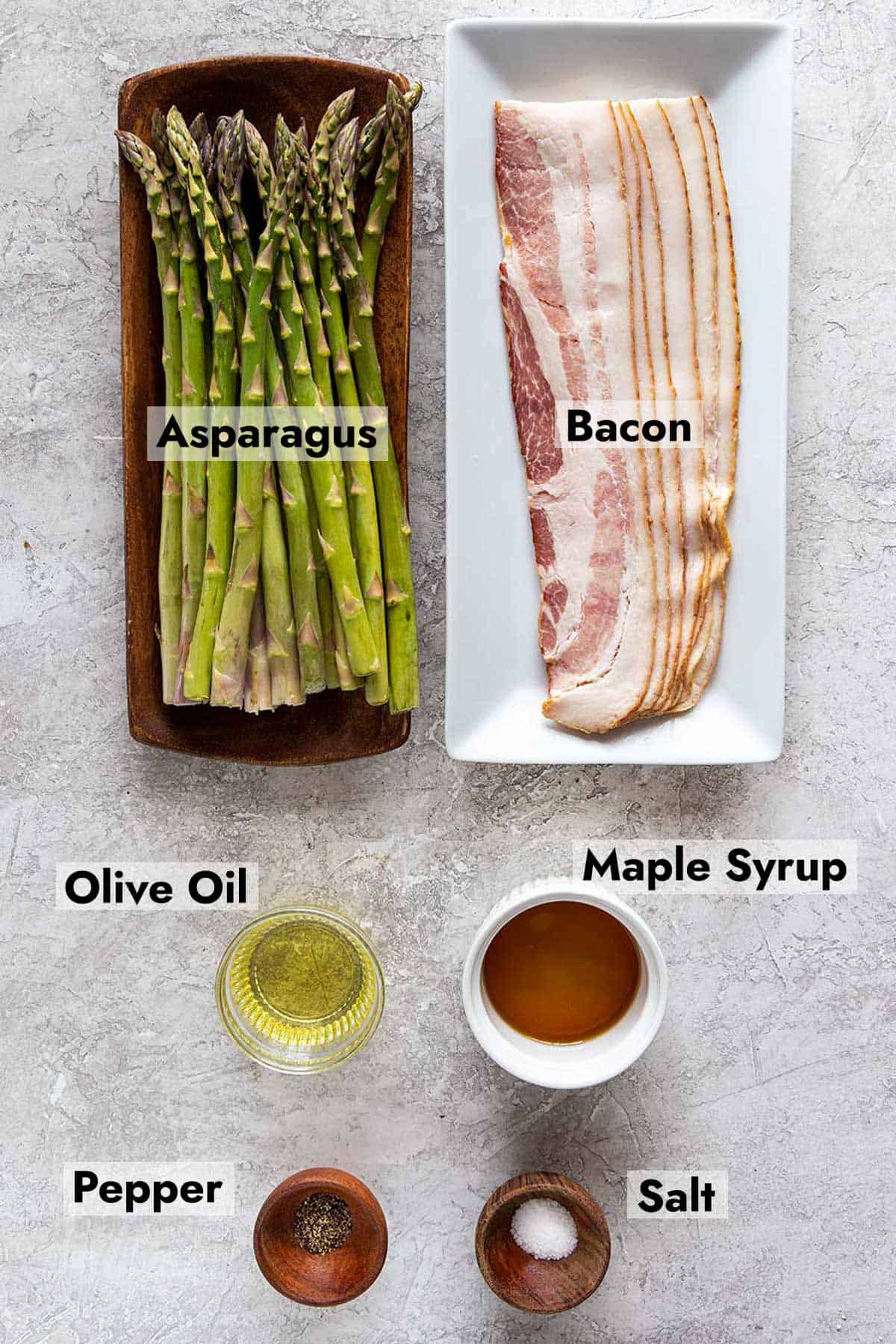 Ingredients with labels called out to make bacon wrapped asparagus.