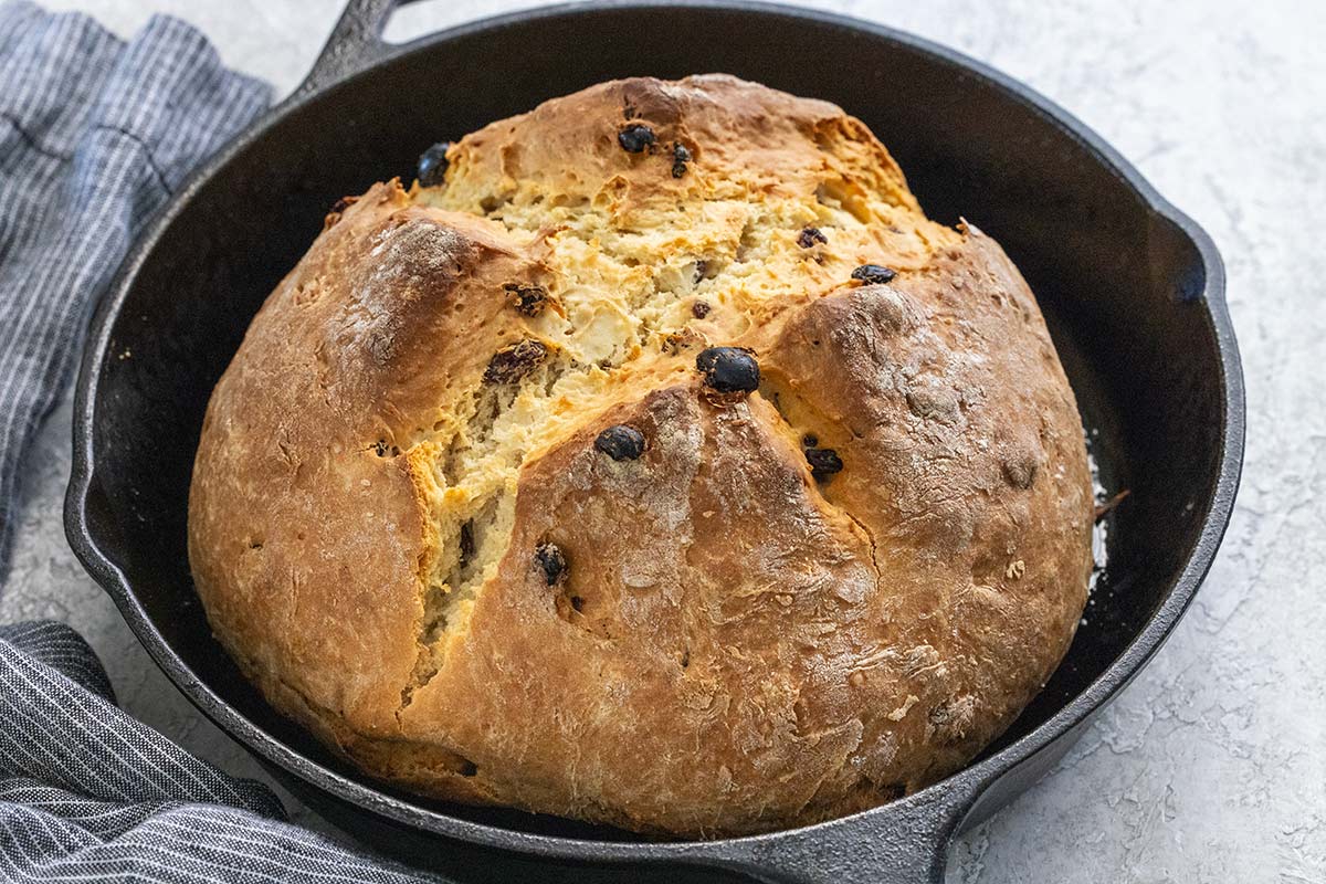 Freshly baked Irish soda bread in a cast iron skillet.
