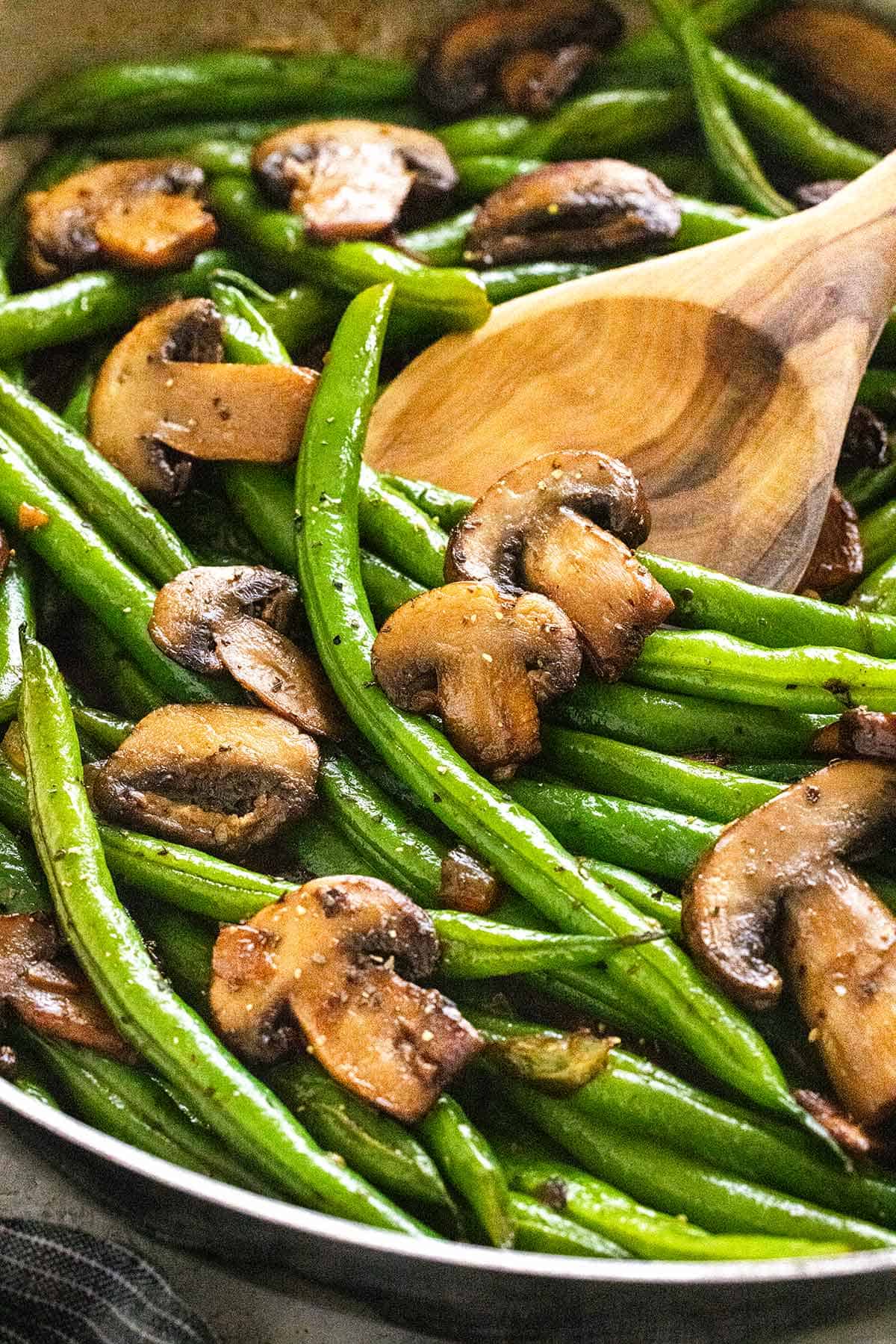 Delicious green beans and mushrooms side dish ready to serve with any meal.