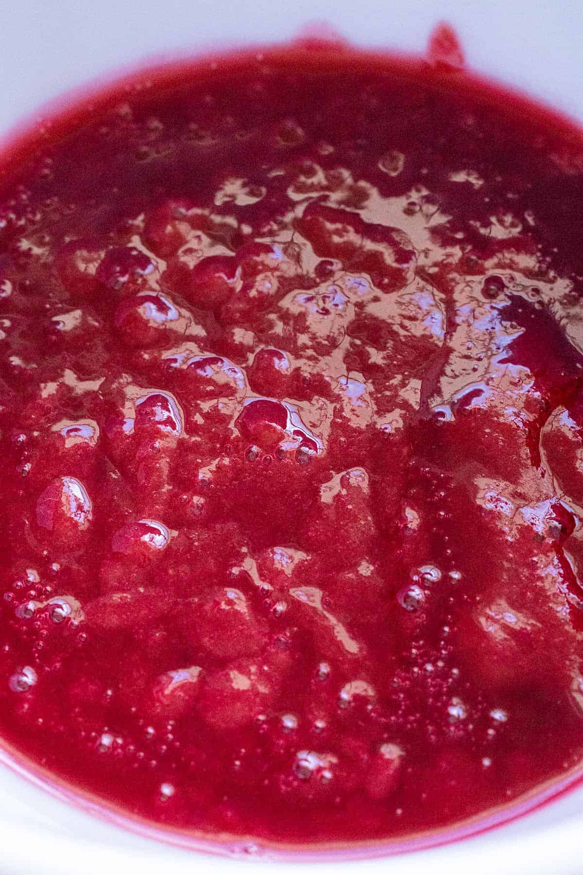 A smooth raspberry sauce after being strained.