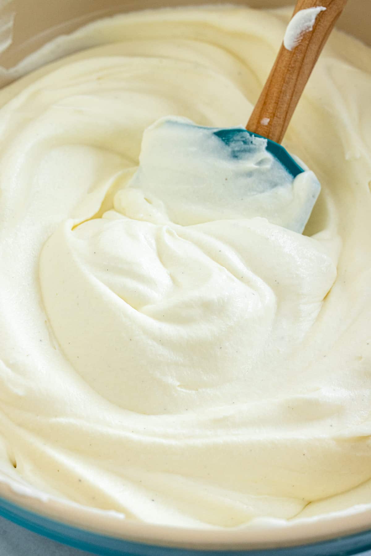 No churn ice cream based being mixed together with a spatula.