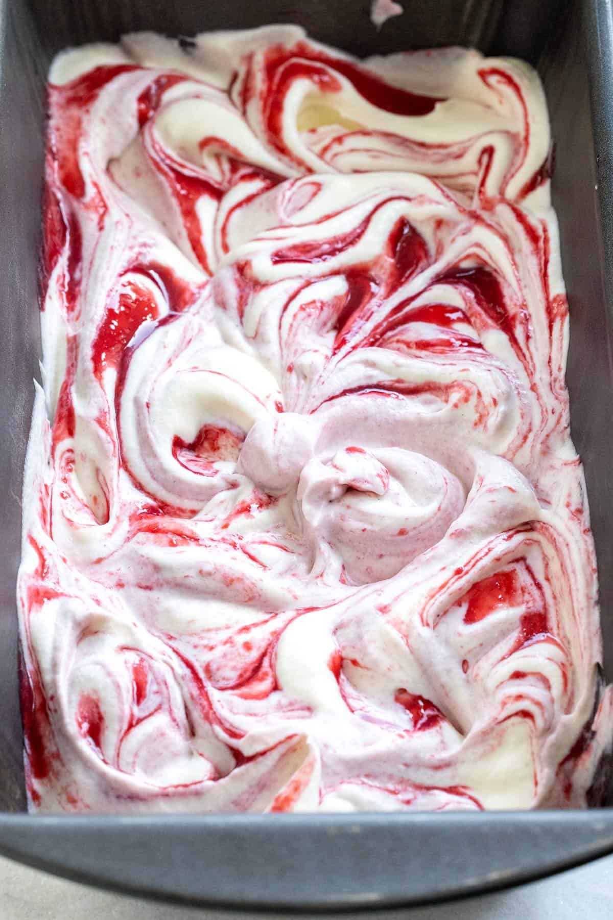 Raspberry swirl after mixing with a knife.