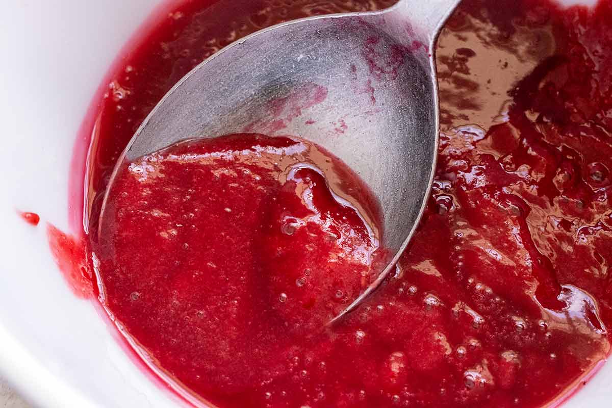 A smooth raspberry sauce after being strained.
