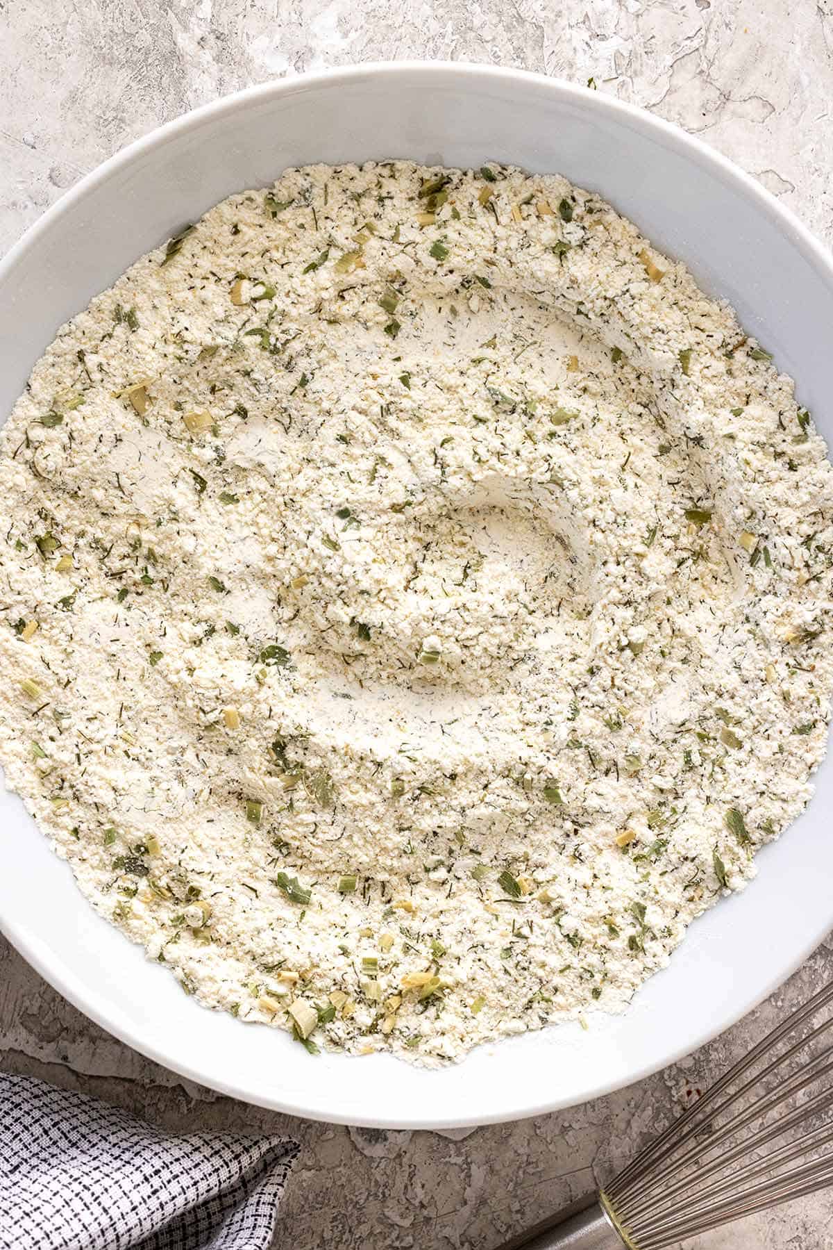 Bowl of ranch seasoning blend in a bowl after whisking the ingredients together.