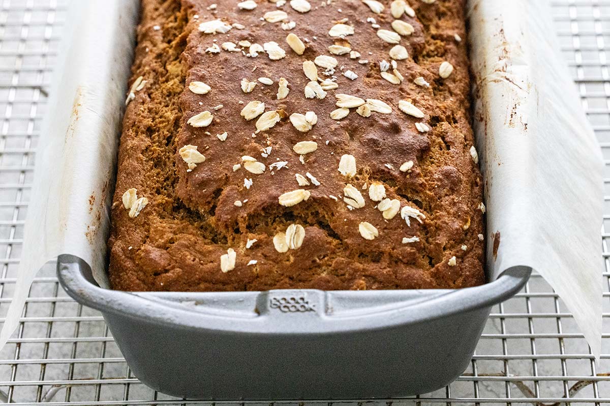 Freshly baked Irish brown bread cooling in a loaf pan.