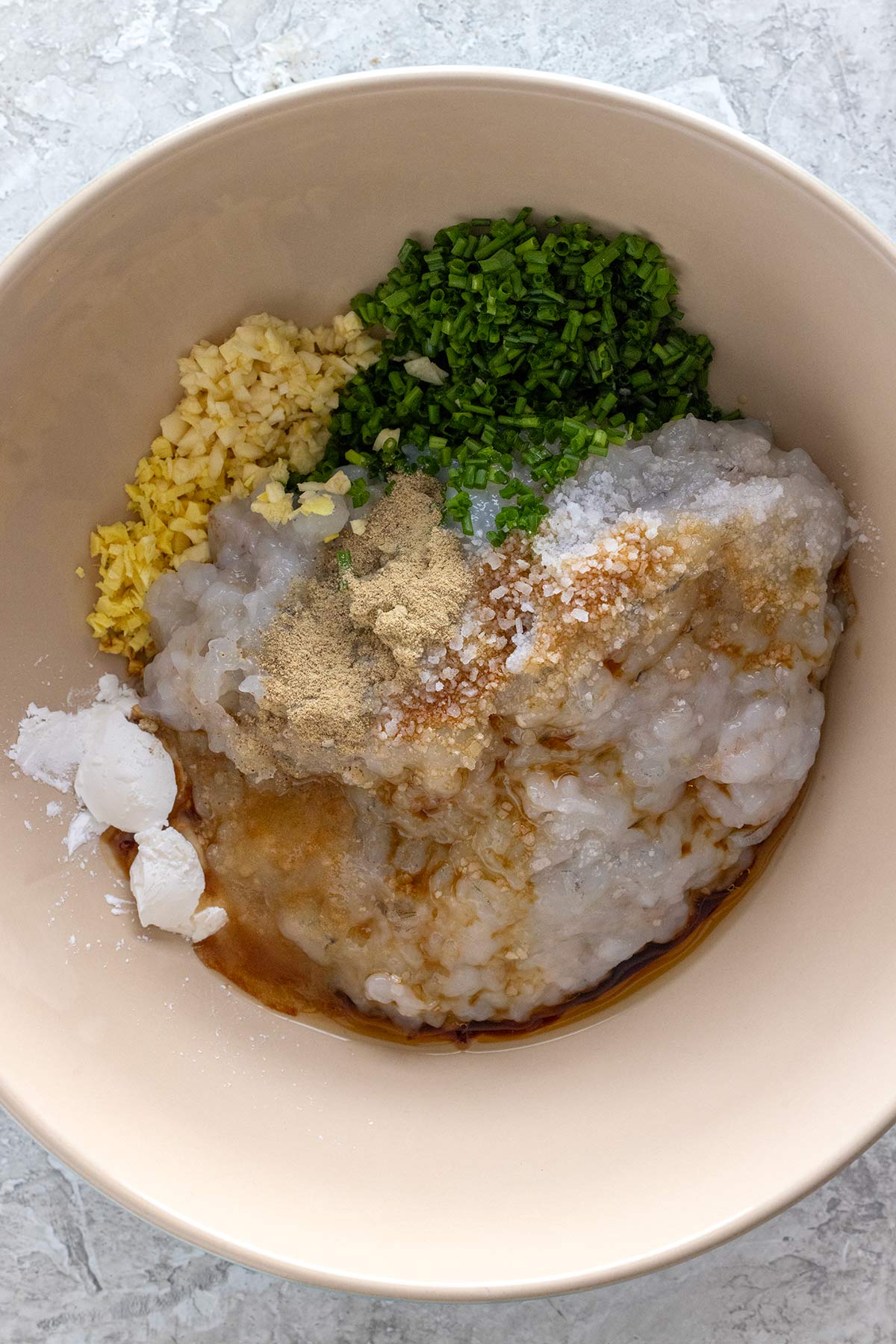 Shrimp dumpling ingredients placed in a mixing bowl.