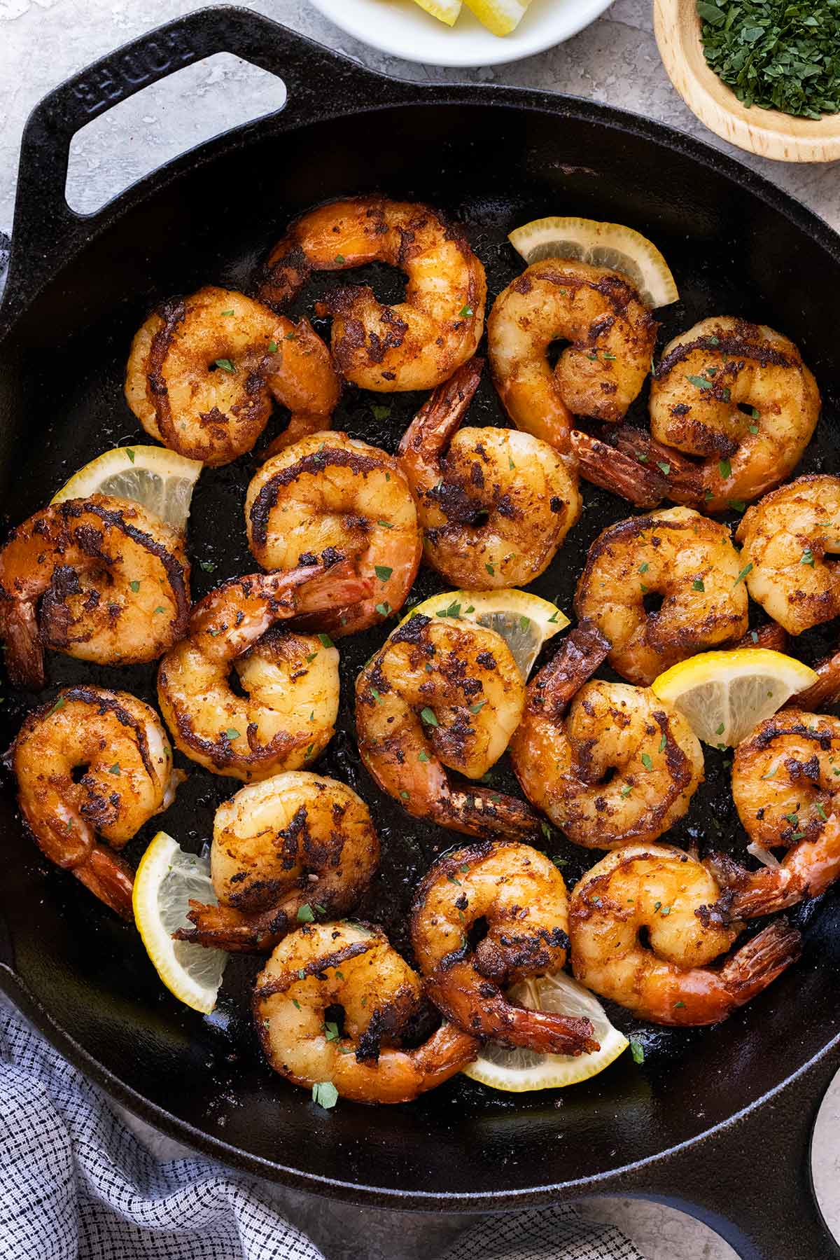 Delicious blackened shrimp in a cast iron pan.