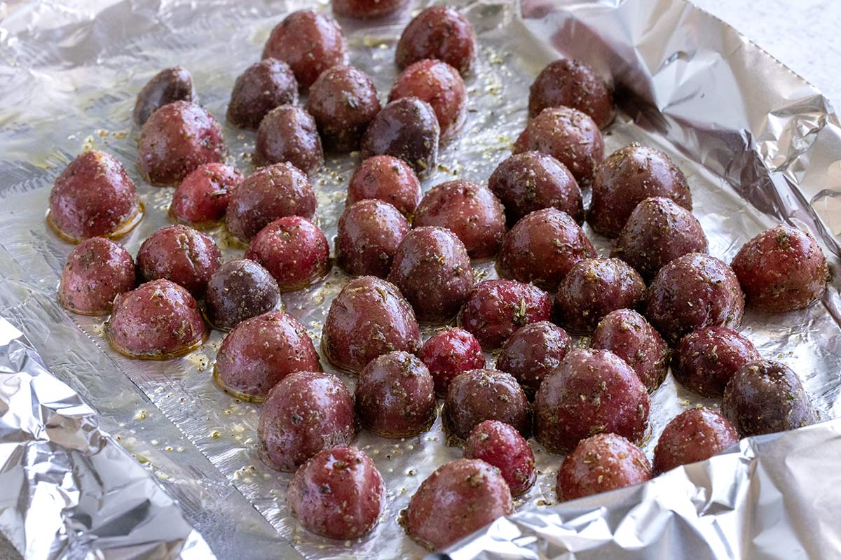 Potatoes placed on a sheet of foil.