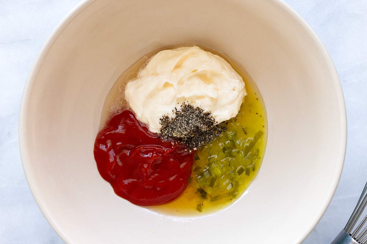 Bowl of mayonnaise, ketchup, and relish.