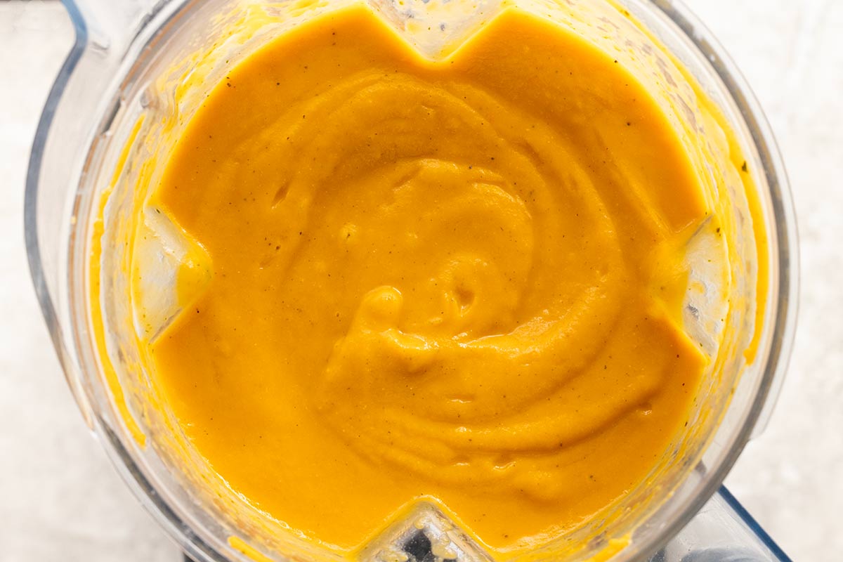 Blender cap with vegetable puree inside.