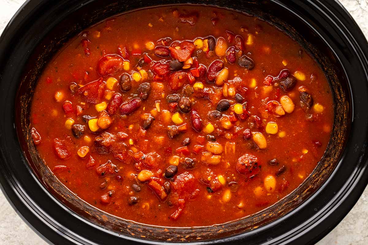 Vegetarian chili cooking in a slow cooker.