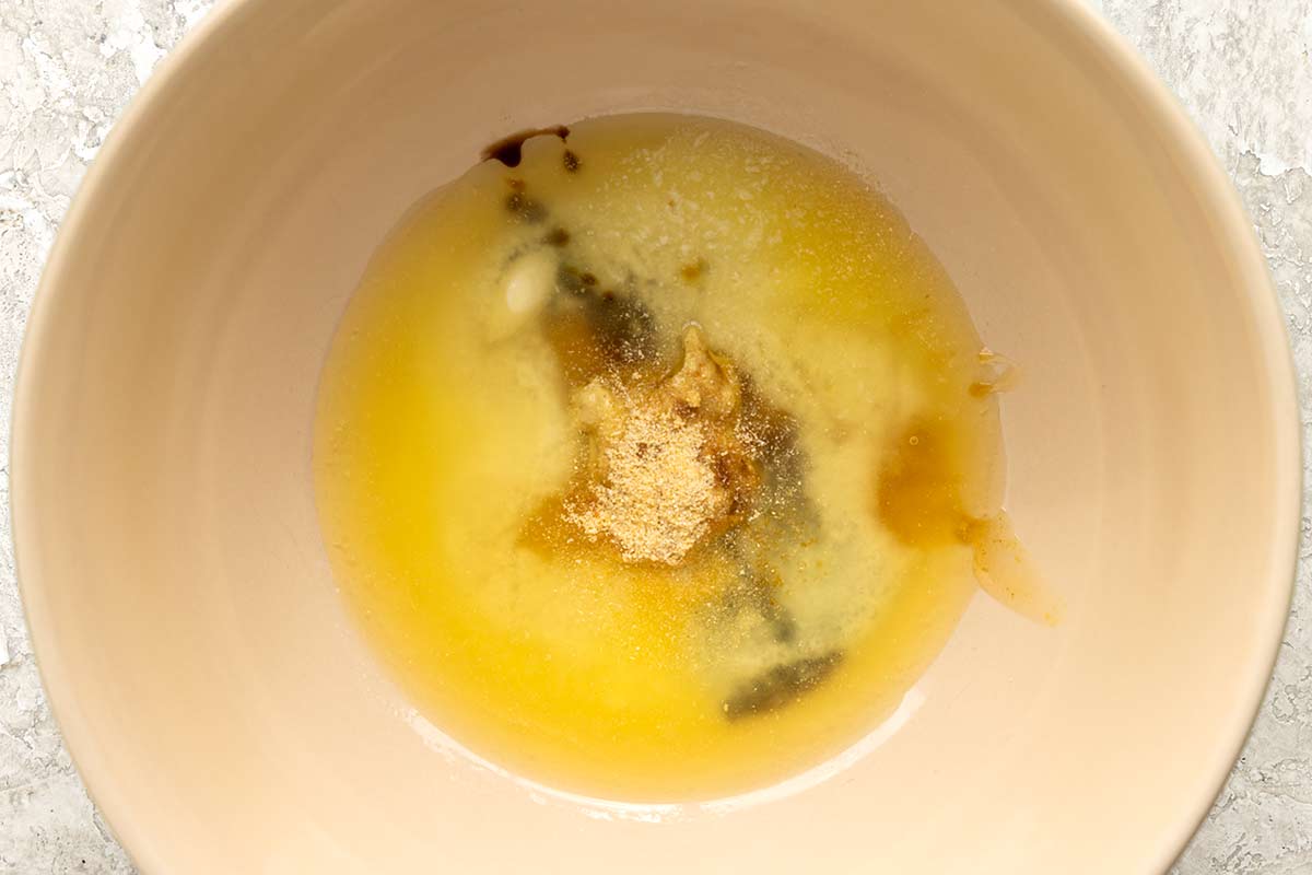 Melted butter and spices in a mixing bowl.