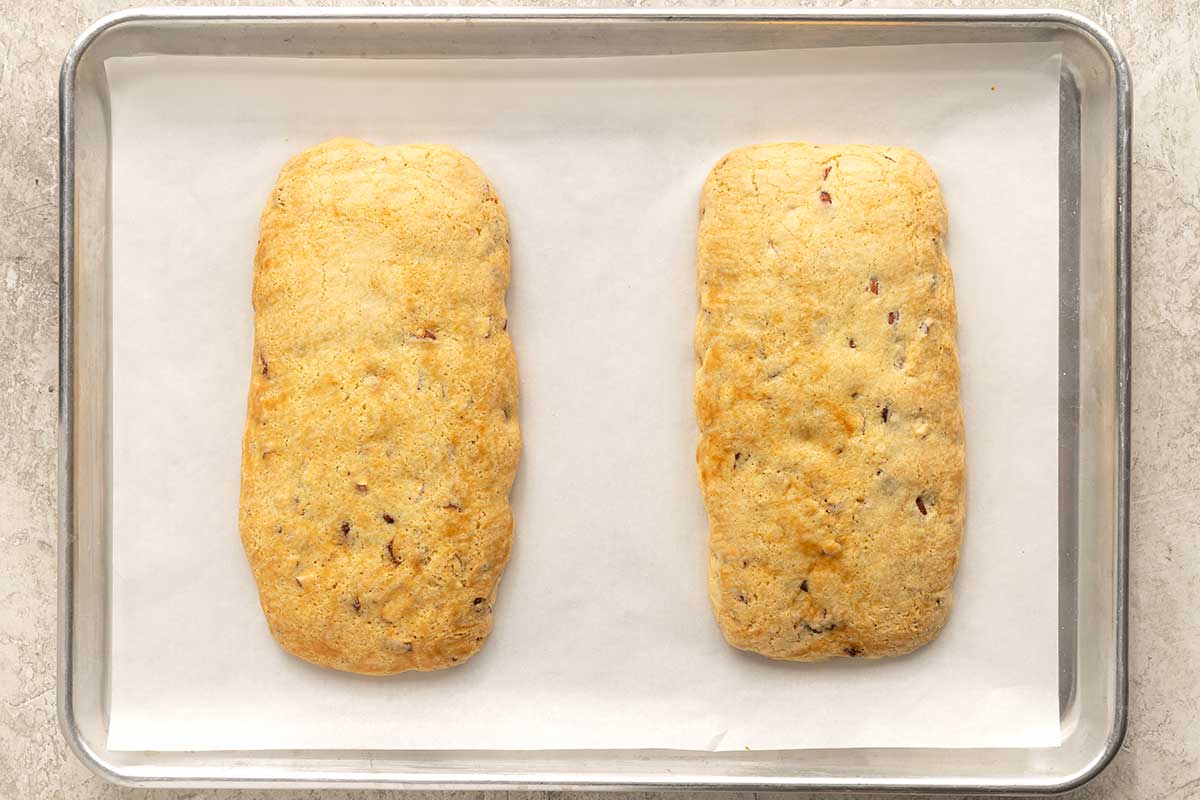 Two portions of biscotti dough after baking.
