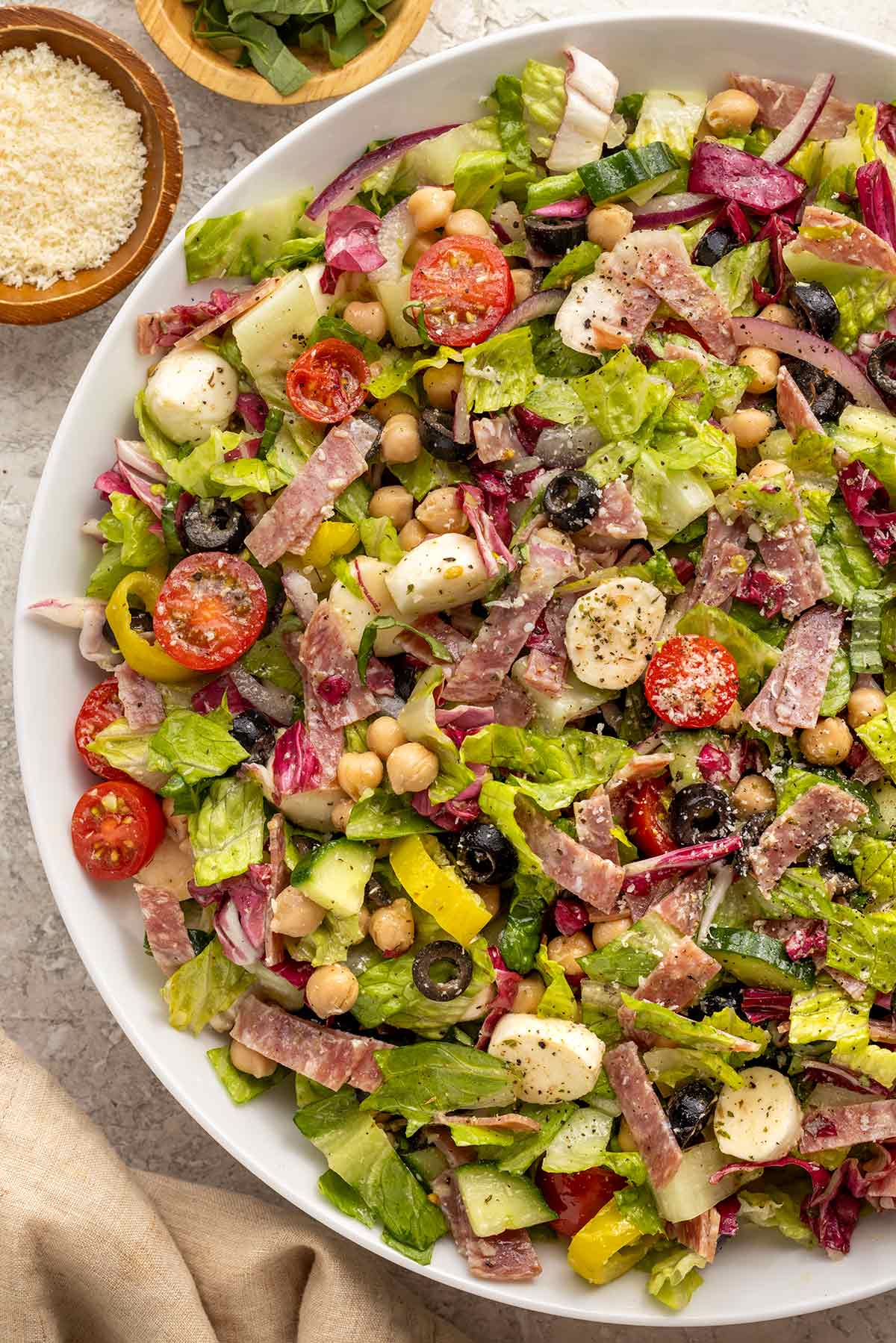 Homemade Italian chopped salad served in a large white bowl.