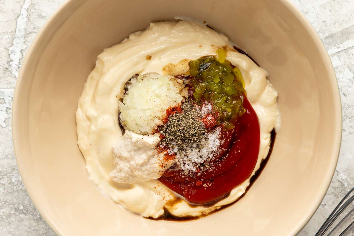 Mayonnaise, ketchup, horseradish in a mixing bowl.