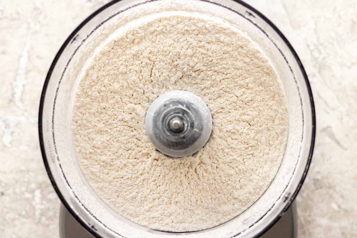 Flour and sugar mixed together in a food processor.