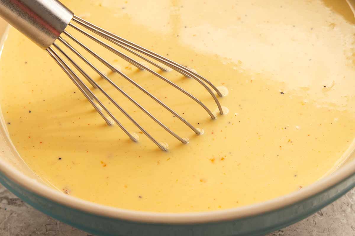 Whisk in a bowl of mixed egg custard.
