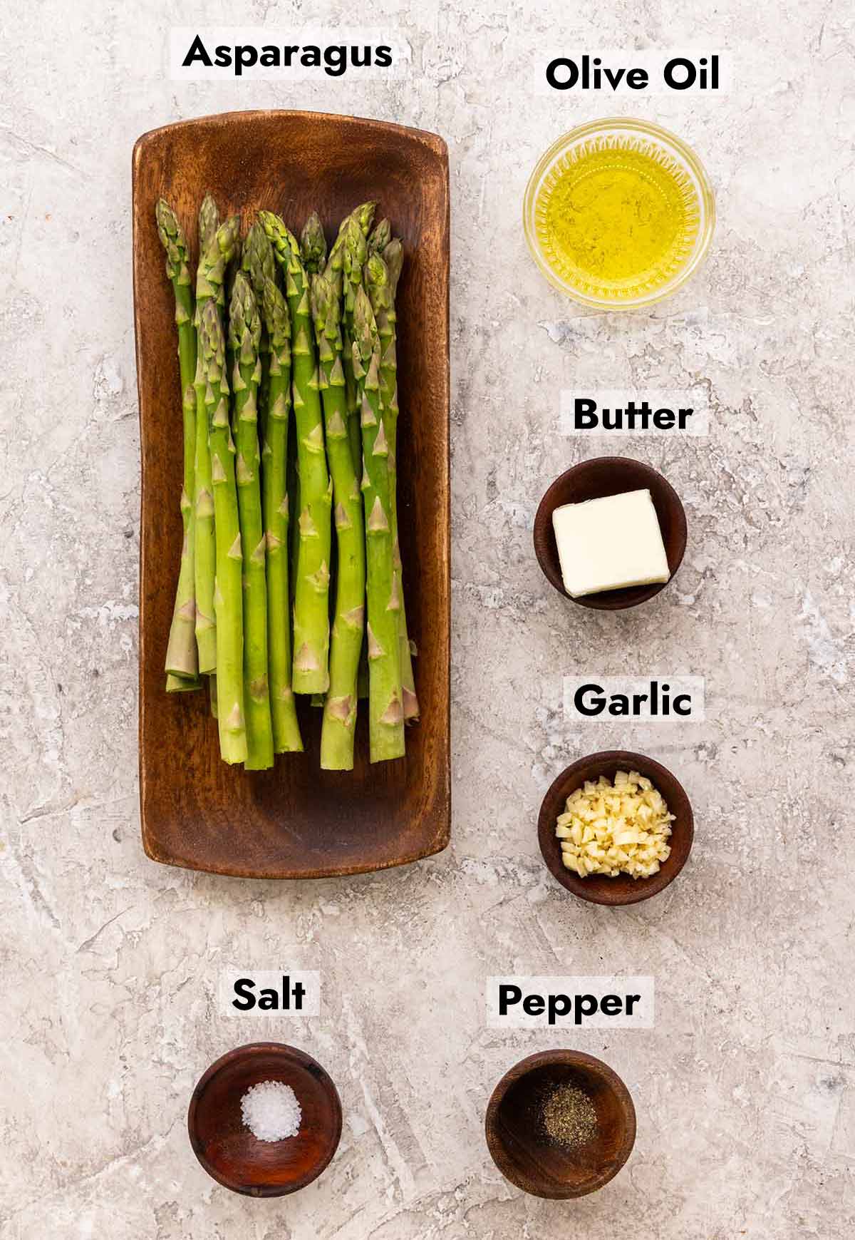 Asparagus talks and little bowls of olive oil, butter, garlic, salt, and pepper.